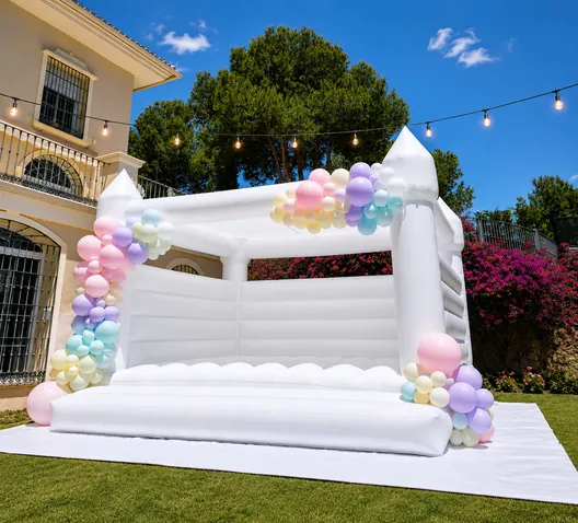 Juegalandia Exclusive White Bouncy Castle set up for a party, available to hire in Málaga and the Costa del Sol
