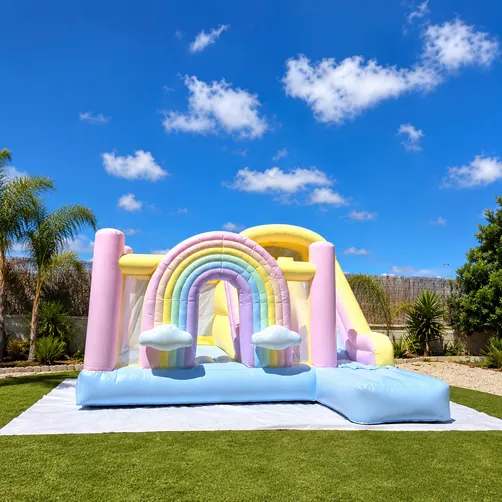 Juegalandia Rainbow Bouncy Castle set up for a party, available to hire in Málaga and the Costa del Sol